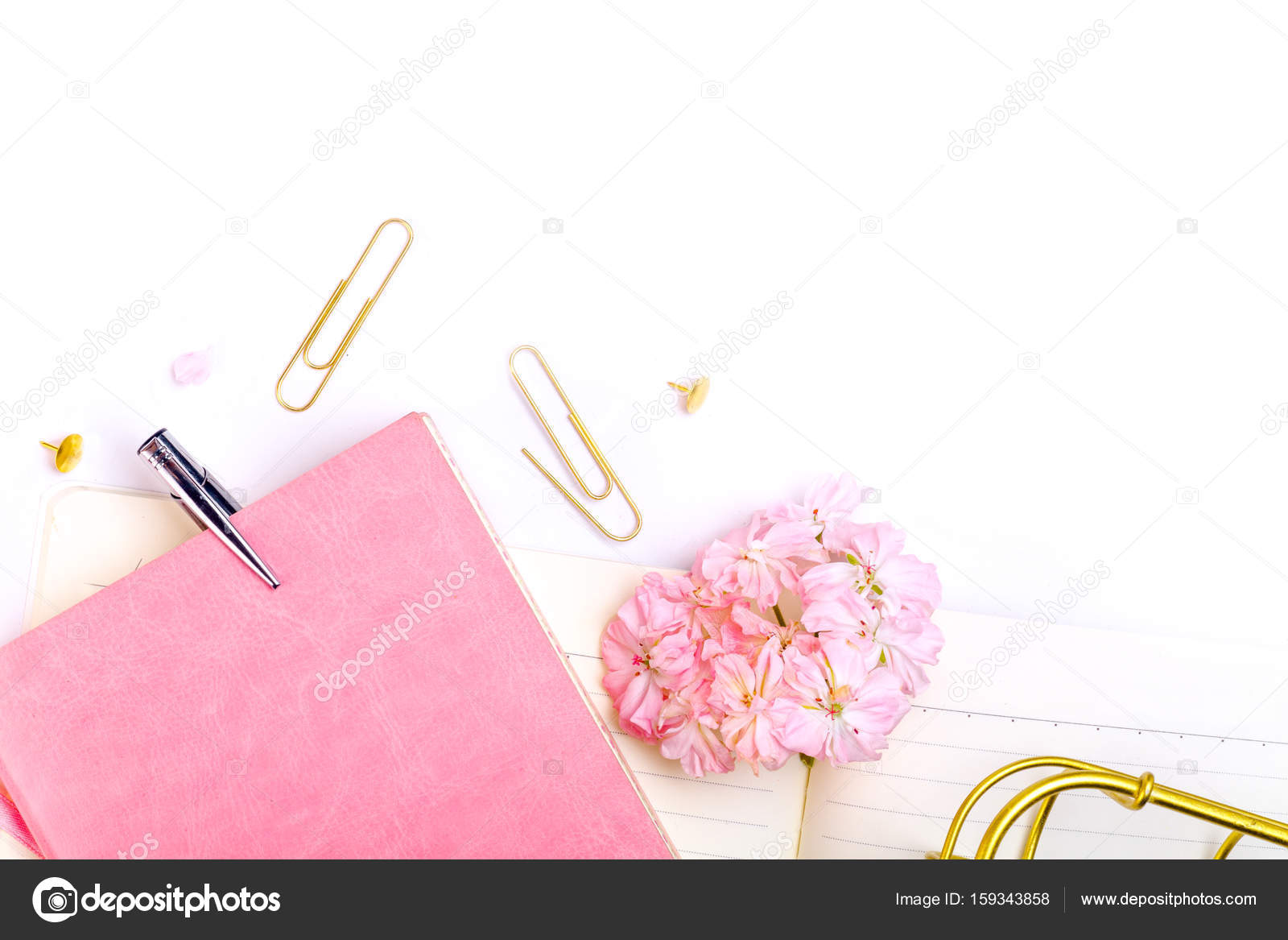 Notebook, pen and pink flowers Stock Photo by ©asinskki 159343858