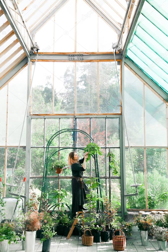 Young cute lady florist working 