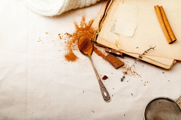 Tea spoon with spilled cinnamon powder