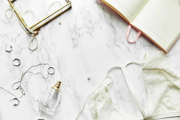 Female Lace Lingerie Perfume Jewelry Items White Marble Background Beauty — Stock Photo, Image