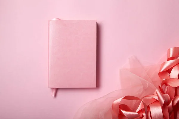 Pink Notebook Shiny Pink Satin Ribbon Pink Background Monochromatic Concept — Stock Photo, Image