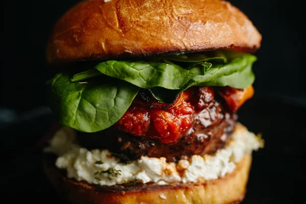 burger with grilled beef patty and cream cheese with spinach on classical bun