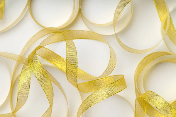 Shiny Golden Ribbons Winded Spiral Pattern White Background — Stock Photo, Image