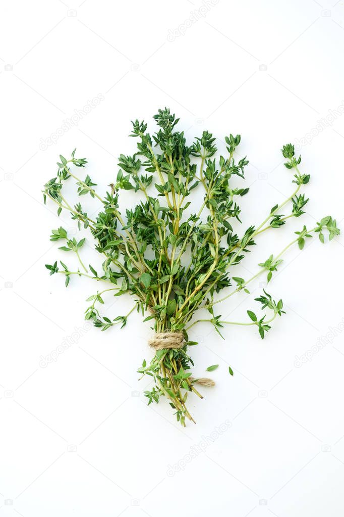 bouquet of fresh thyme twigs isolated on white background 