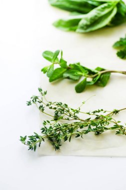 bunches of thyme and mint with basil herbs isolated on white background, close-up  clipart