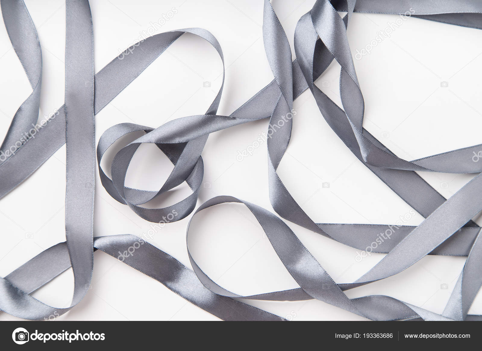 Curled Gray Silk Ribbon Isolated On White Stock Photo, Picture and Royalty  Free Image. Image 91696418.