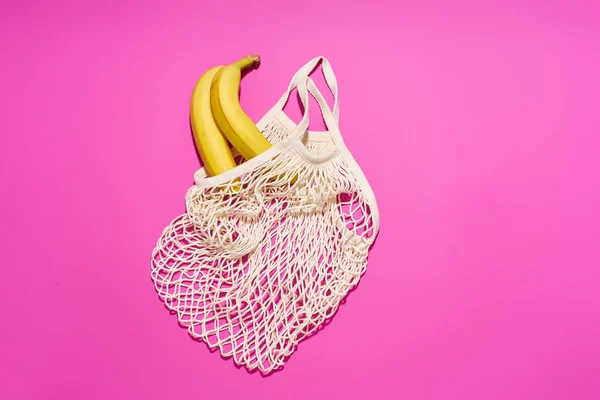 Textile Net Bag Bananas Bright Pink Background Plastic Free Concept — Stok fotoğraf