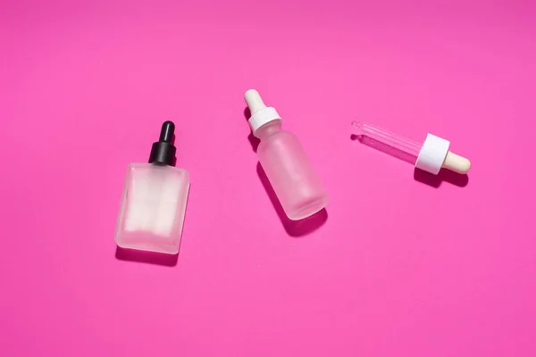 Serum Bottles Tube Dropper Pink Background Cosmetic Flat Lay — Stockfoto