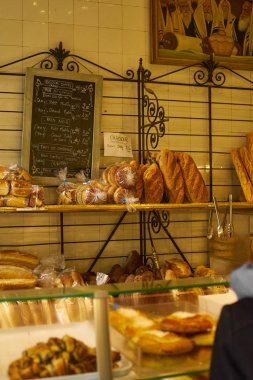 PARIS, FRANCE - NOVEMBER 6, 2019: Challah and buns at the display of traditional jewish bakery at Marais quartier in Paris                              