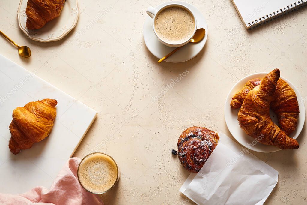 coffee and croissants on table. Breakfast in bakery concept
