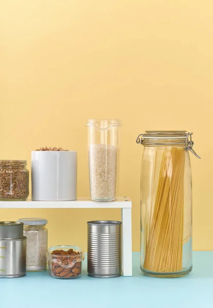 Food staples on pantry shelf prepared to survive Coronavirus COVID 19 pandemic at the time of quarantine and home isolation