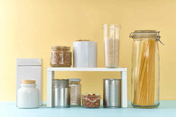 Food staples on pantry shelf prepared to survive Coronavirus COVID 19 pandemic at the time of quarantine and home isolation