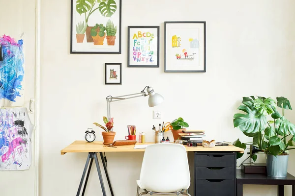 Artist\'s workplace for working from home with watercolor paints, brushes and sketchbooks. Place for design, illustration and creativity.