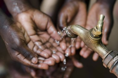 hands taking water from tap clipart