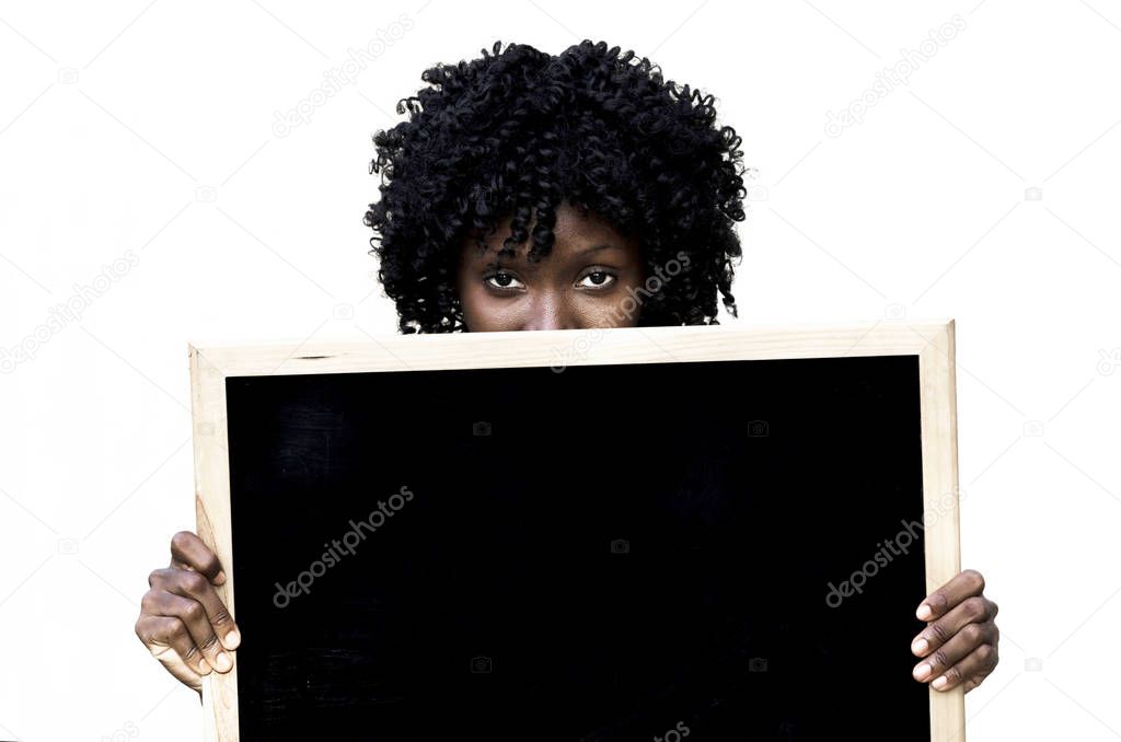 Girl holding signboard and looking at camera