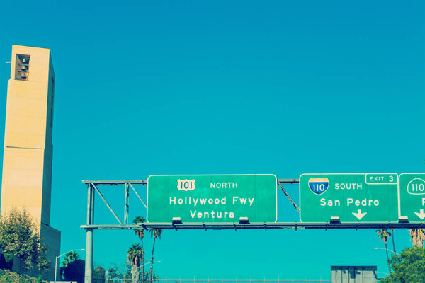 Hollywood freeway sign by Cathedral of Our Lady of Angels steepl