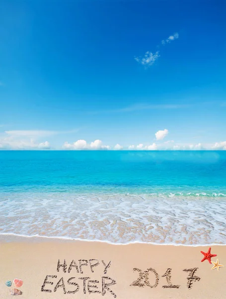 Happy easter 2017 on a tropical beach under clouds — Stock Photo, Image