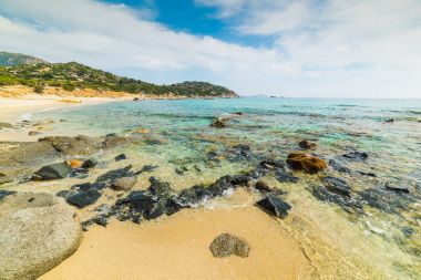 Kayalar ve kum Porto Sa Ruxi Beach