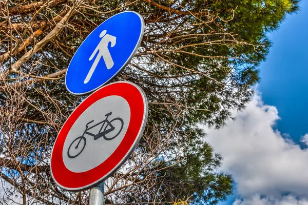 Bike and pedestrian signs in springtime