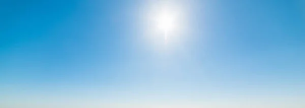 Sun shining on the blue sky — Stock Photo, Image