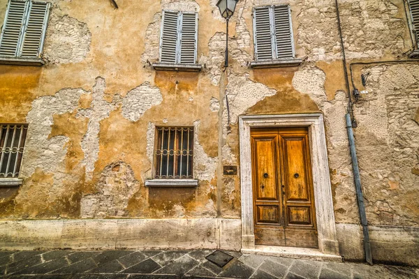 Rustykalne ściany w San Quirico d'Orcia. — Zdjęcie stockowe