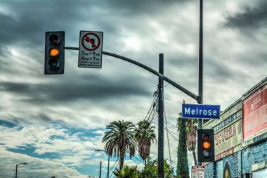 Melrose sign under a cloudy sky clipart
