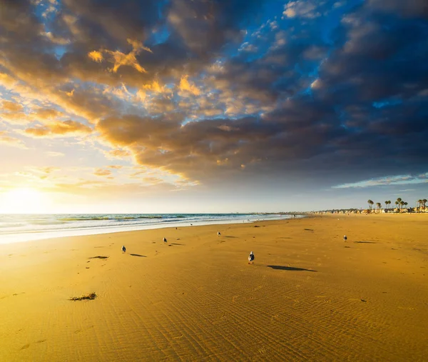 Dramatic sky over Newport Beach at sunset — Stock Photo, Image