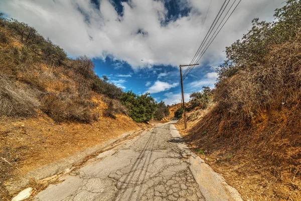 Cloudy sky over a walk path in Bronson Canyon — Stock Photo, Image