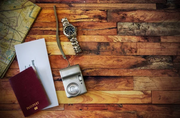 Travel flat lay with passport, camera, map, watch and airline ti — 스톡 사진