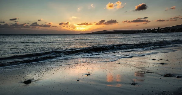 Reflection on the shore at sunset — Stock Photo, Image