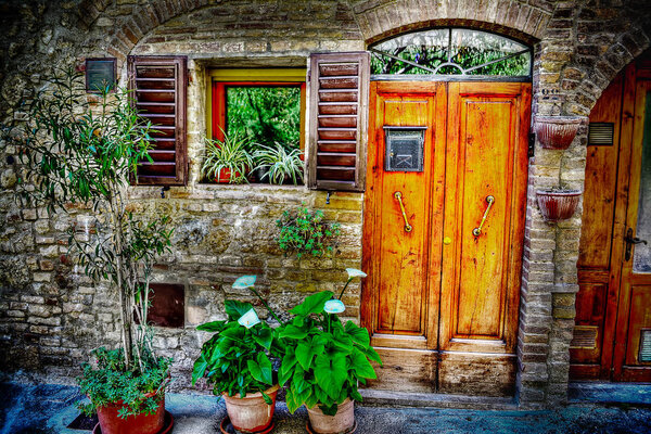 Picturesque facade of a San Gimignano house, Italy