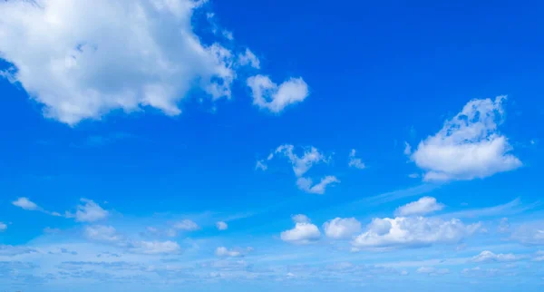 blue sky with white, soft clouds