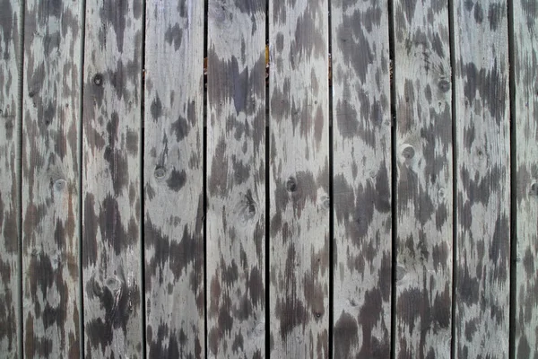 Spotted wooden fence background — Stock Photo, Image