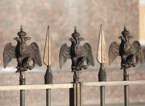 Double-headed eagle on the fence — Stock Photo, Image