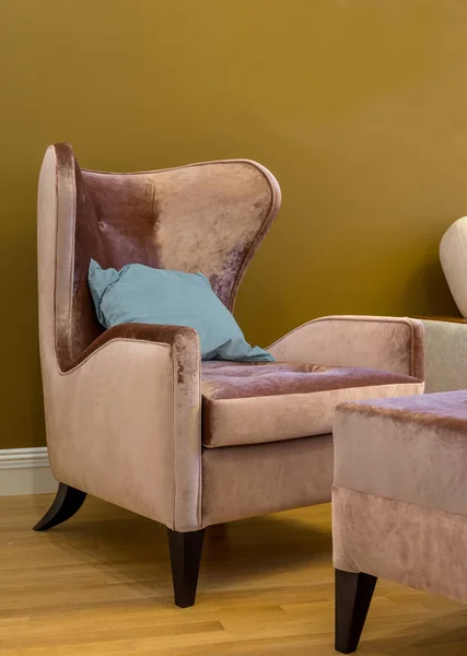 Wing chair with blue cushion Stock Image