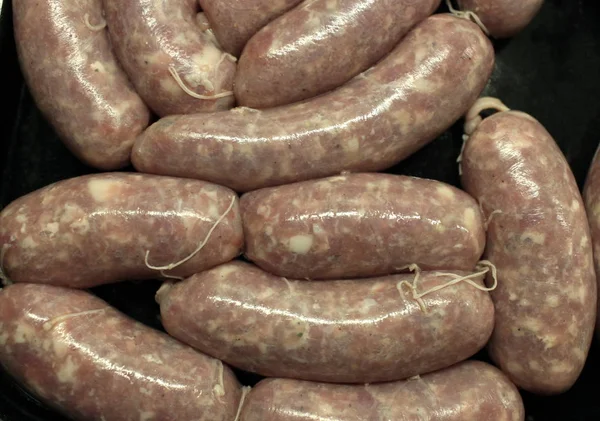 Fried sausages in a pan — Stock Photo, Image