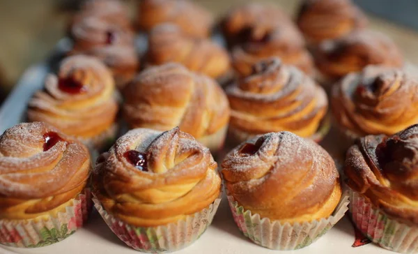 Muffins fresh pastry on baking sheet — Stock Photo, Image