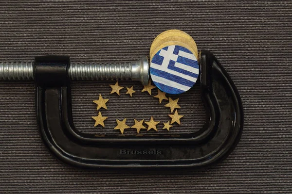 그리스 동전은 클램프 압력 — 스톡 사진