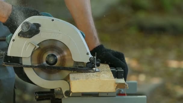 Carpenter Circular Saw Cutting Wooden Plank Slow Motion — Stock Video