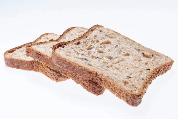 一套三片新鲜面包 在白色的背景上烘烤 顶部视图 — 图库照片