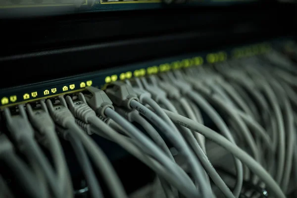 Close up of cables in rack in server room
