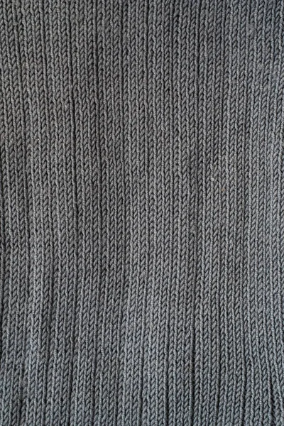 Close-up of seamless gray knitted fabric texture. — Stock Photo, Image