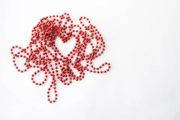 Valentine's day with heart bead on white background and place for signature — Stock Photo, Image