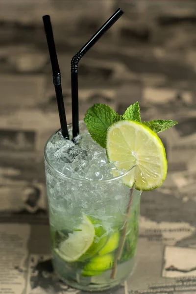 Alcohol bar, cocktail glass on bar counter, cocktail glass in a bar, Drinking cocktail in bar, cocktail in the glass with straws, Fresh drink coctail on a color background