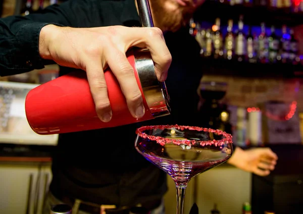 Alcohol bar, cocktail glass on bar counter, cocktail glass in a bar, Drinking cocktail in bar, cocktail in the glass with straws, Fresh drink coctail on a color background