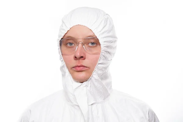 Portrait of young nurse in protective white medical uniform during coronavirus pandemic. Epidemic, pandemic of coronavirus covid 19. — Stock Photo, Image