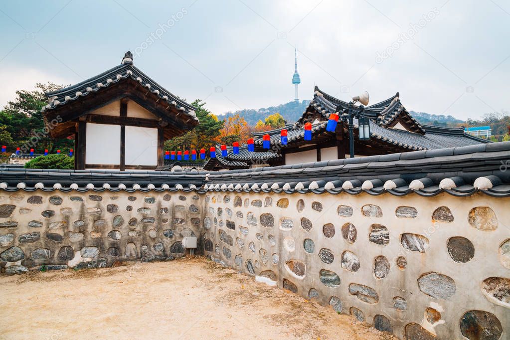 Korean traditional house and Namsan Seoul tower at autumn in Korea