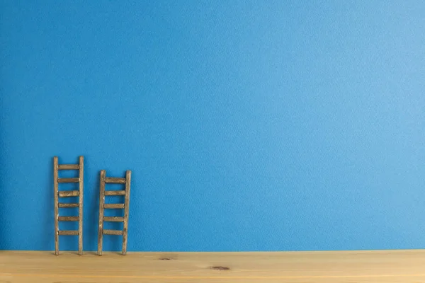 Wooden ladder with blue background. Development growth concept