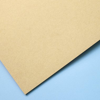 Brown kraft and blue paper sheet overlapping background