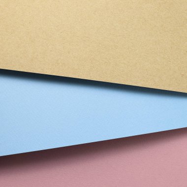Brown kraft and blue paper and pink paper sheet overlapping background